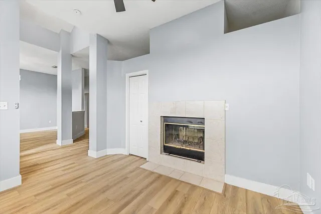a view of an empty room and wooden floor