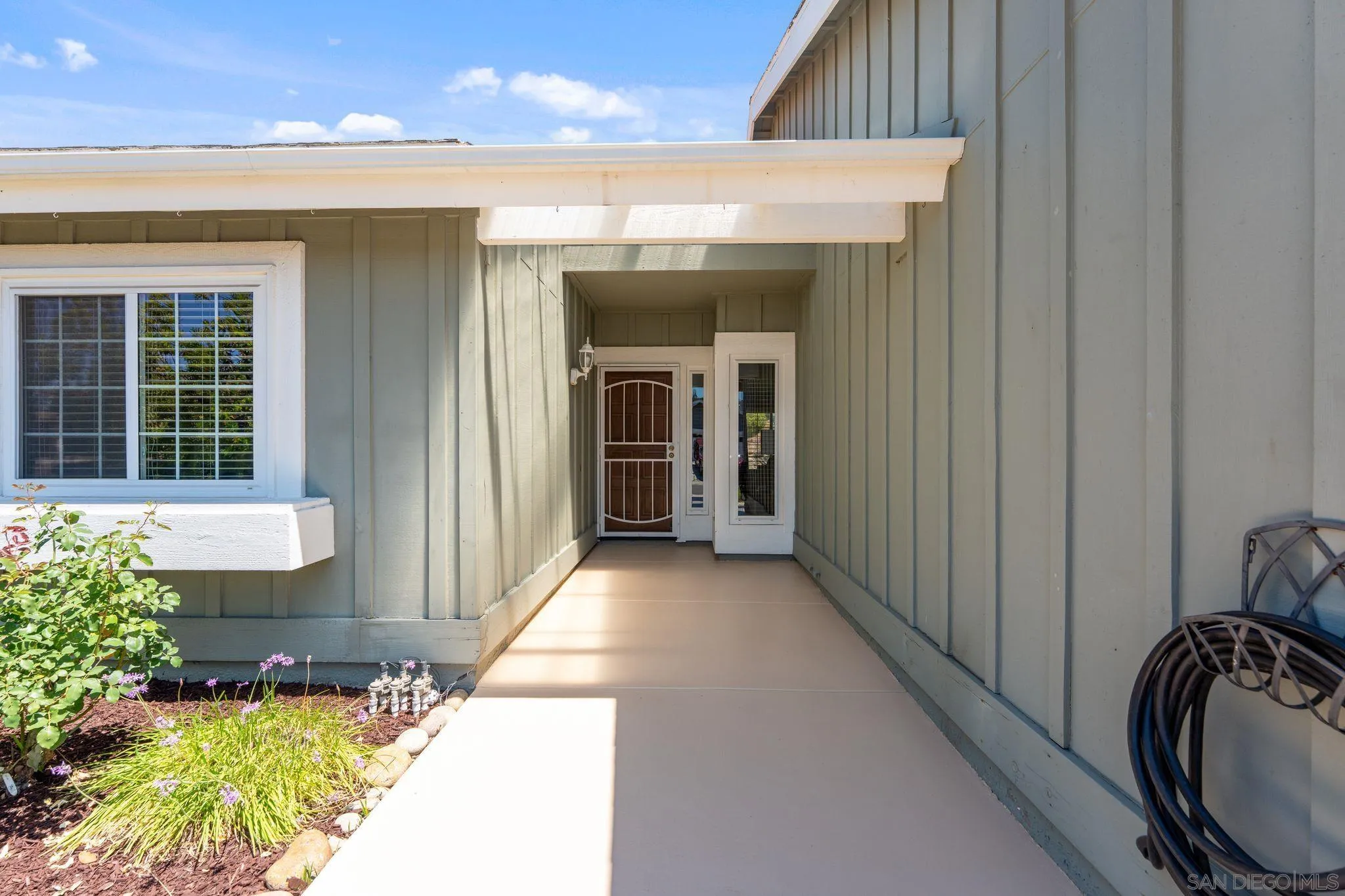 10565 Strathmore Drive Santee, CA 92071 - Photo 47 of 59 a view of a porch with furniture and floor to ceiling window