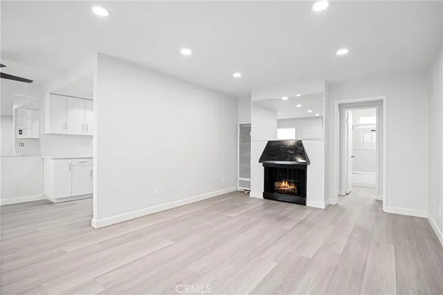 a kitchen with stainless steel appliances a sink a stove and microwave