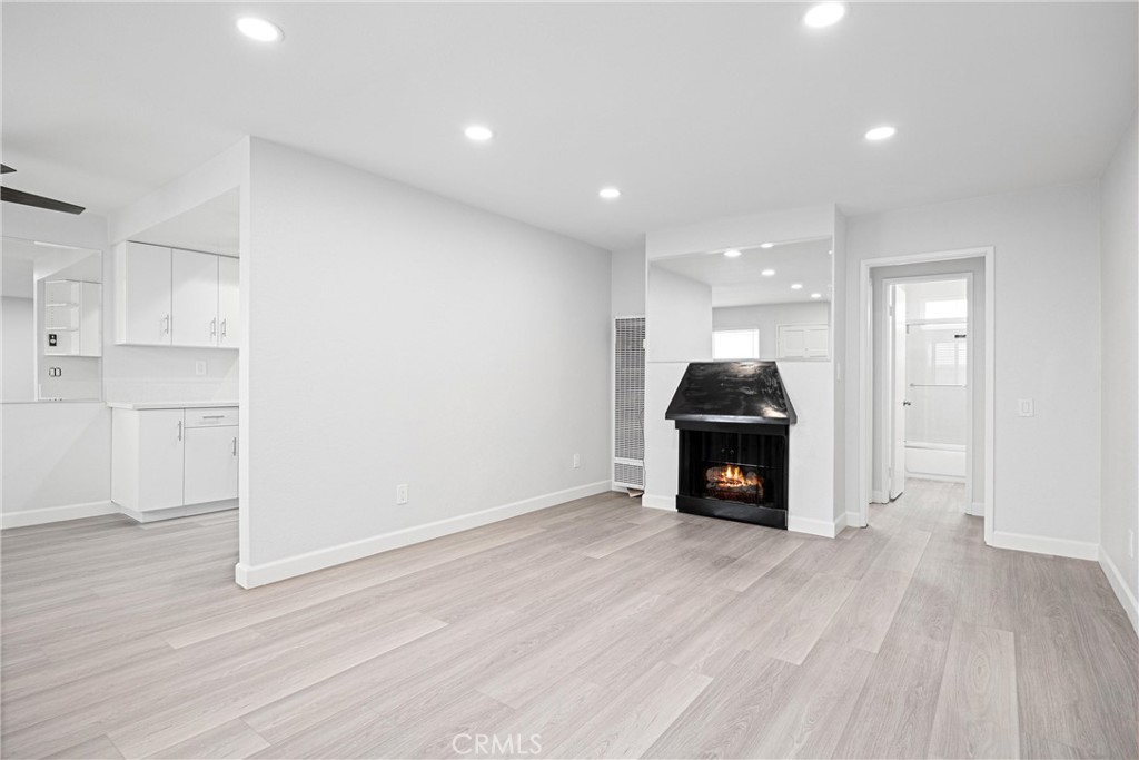 114 10th Street, Unit B Huntington Beach, CA 92648 - Photo 2 of 11 a view of a livingroom with furniture and wooden floor