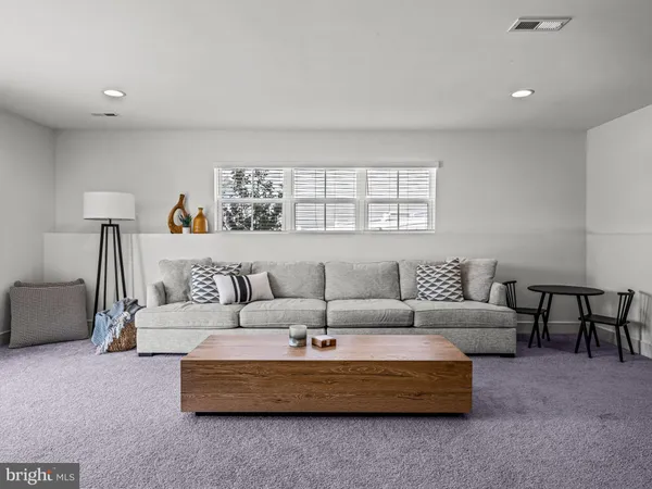 a living room with furniture and a couch