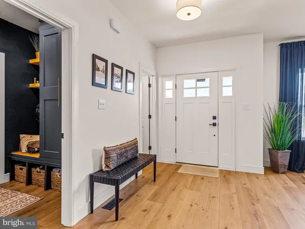 a view of a livingroom with furniture and wooden floor