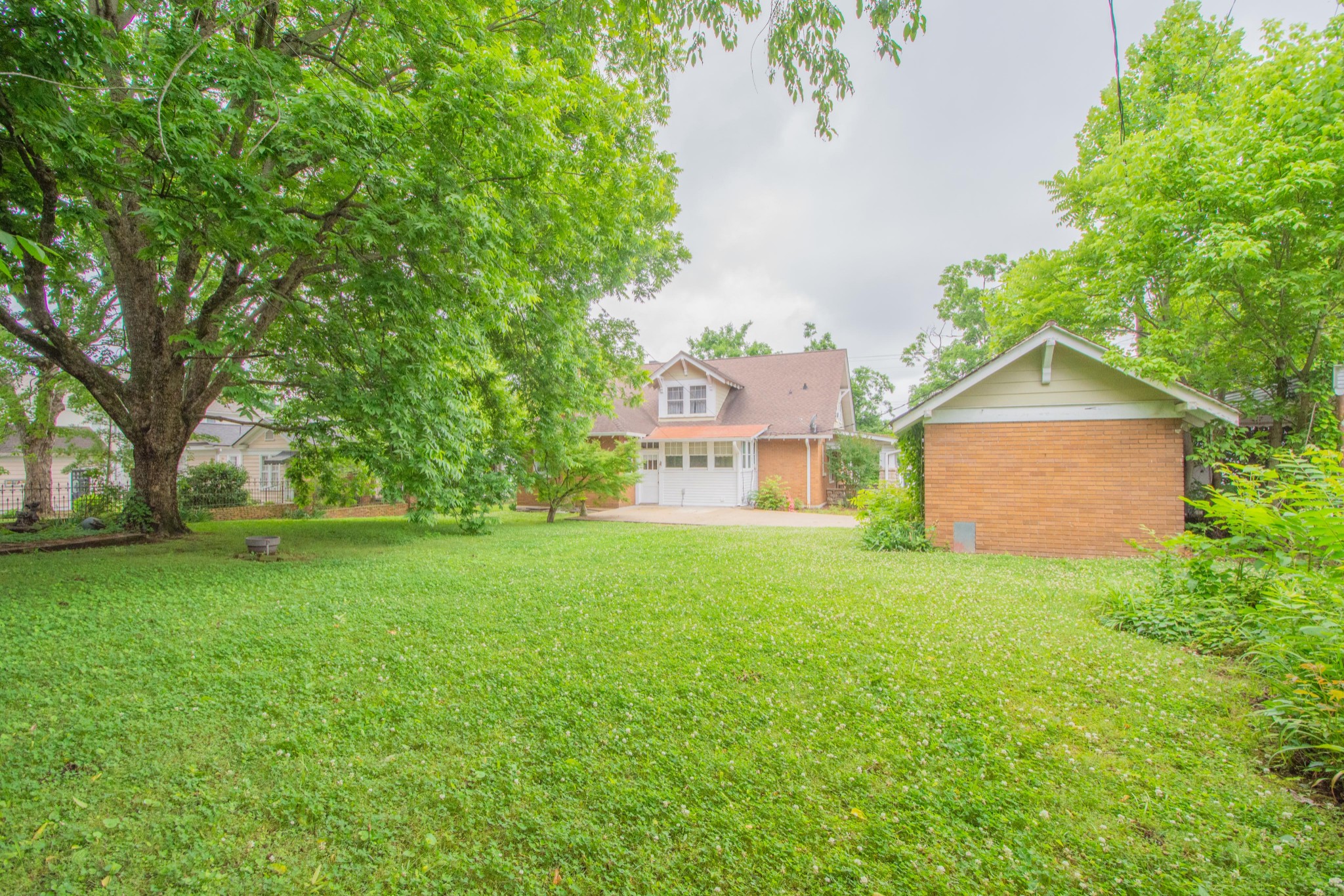 311 South 3rd Street Pulaski, TN 38478 - Photo 42 of 44 a view of a big yard with plants and large trees