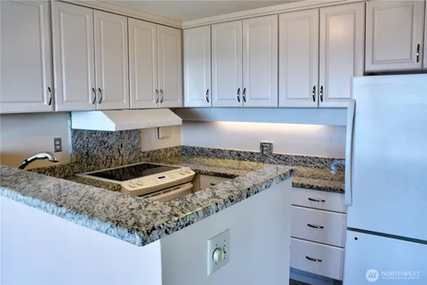 a view of hallway with washer and dryer