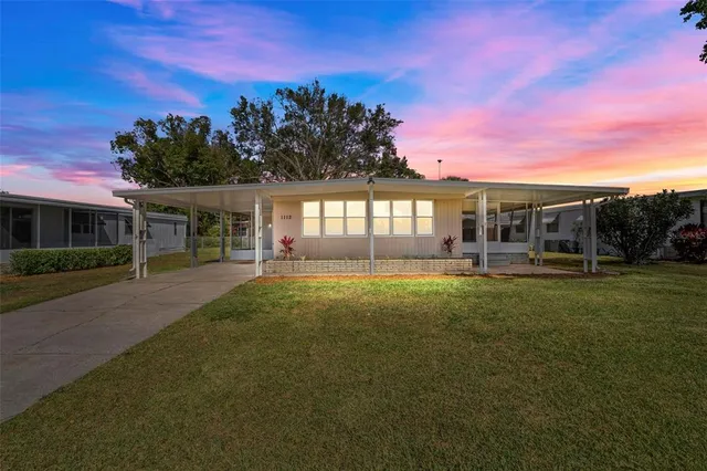 a view of a house with a big yard