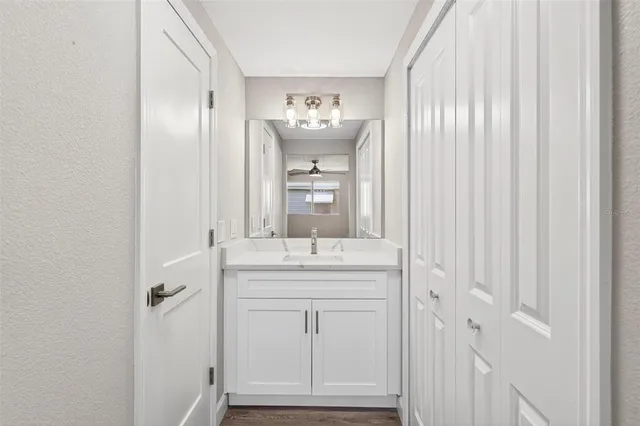 a bathroom with a sink and a mirror