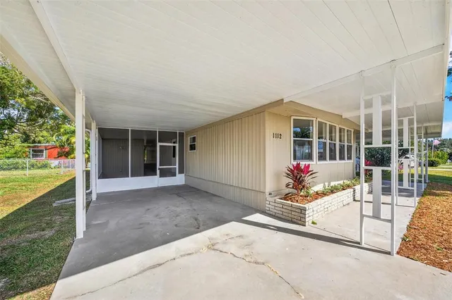 a view of house with a garden and plants