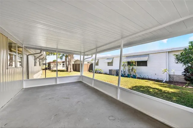 an aerial view of a house with a lake view