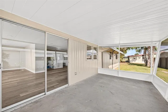 an aerial view of a house with a swimming pool