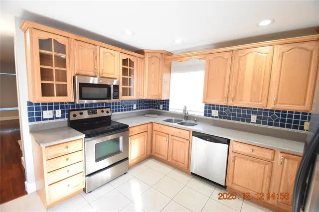 a view of walk in closet with clothes