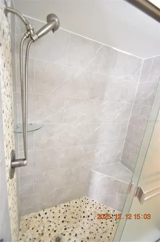 a view of walk in closet with empty room