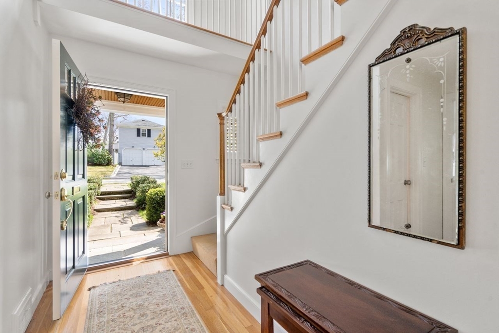 45 Stanford Road Wellesley, MA 02481 - Photo 2 of 40 a view of an entryway with wooden floor and a livingroom view
