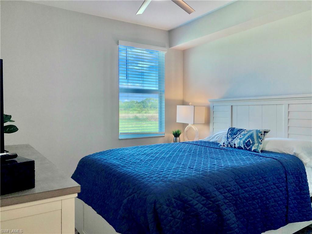 43253 Water Bird Way, Unit 5811 Babcock Ranch, FL 33982 - Photo 15 of 21 a bedroom with a bed and a window