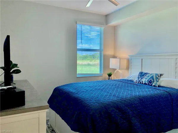 a bedroom with a bed and a closet