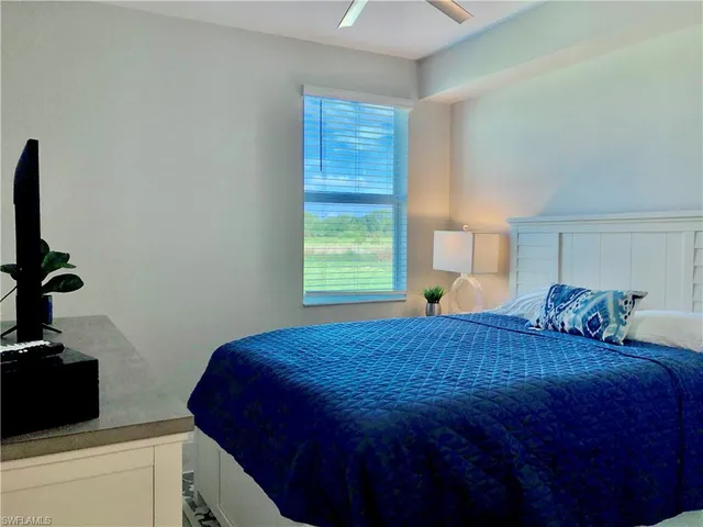 a bedroom with a bed and a closet