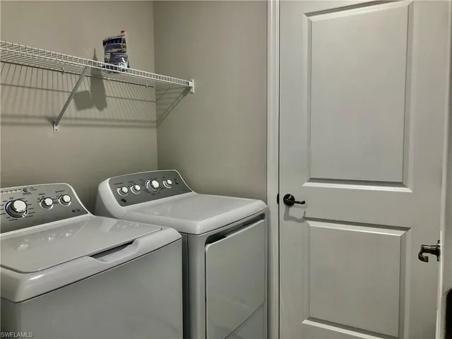 a utility room with dryer and washer