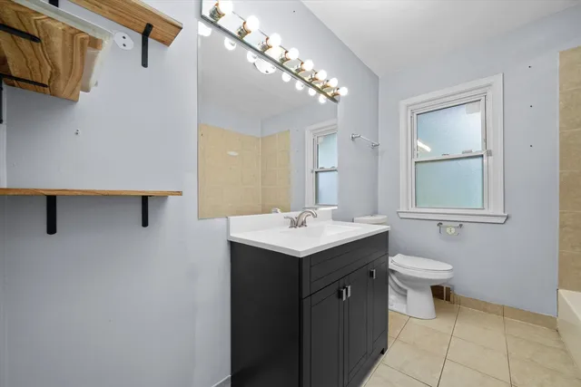 a bathroom with a sink toilet and vanity