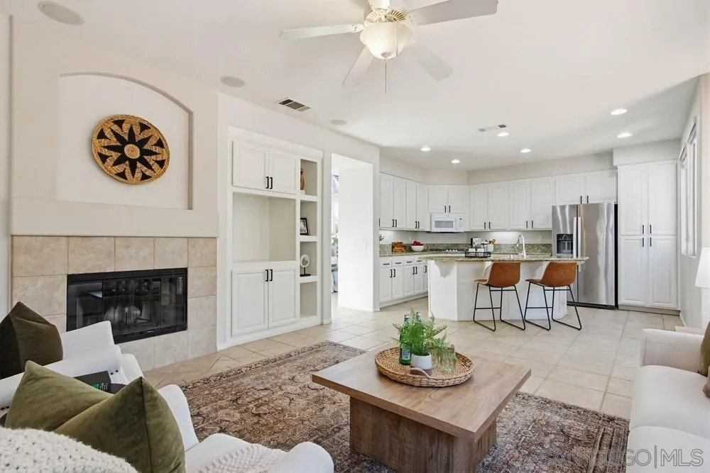 5423 Foxtail Loop Carlsbad, CA 92010 - Photo 19 of 67 a living room with furniture and a fireplace