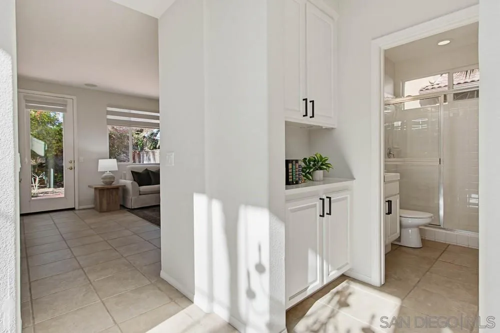 5423 Foxtail Loop Carlsbad, CA 92010 - Photo 20 of 67 a bathroom with a sink a toilet and shower
