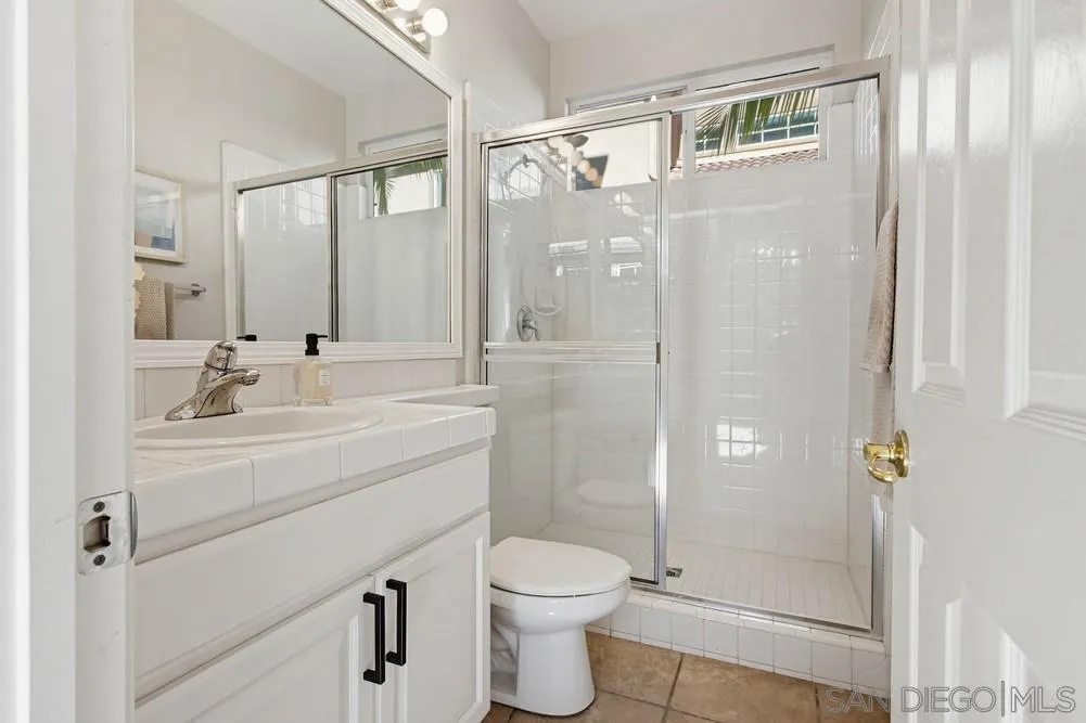 5423 Foxtail Loop Carlsbad, CA 92010 - Photo 21 of 67 a bathroom with a sink toilet and shower
