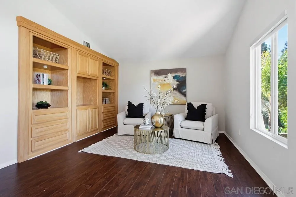 5423 Foxtail Loop Carlsbad, CA 92010 - Photo 29 of 67 a living room with furniture window and wooden floor