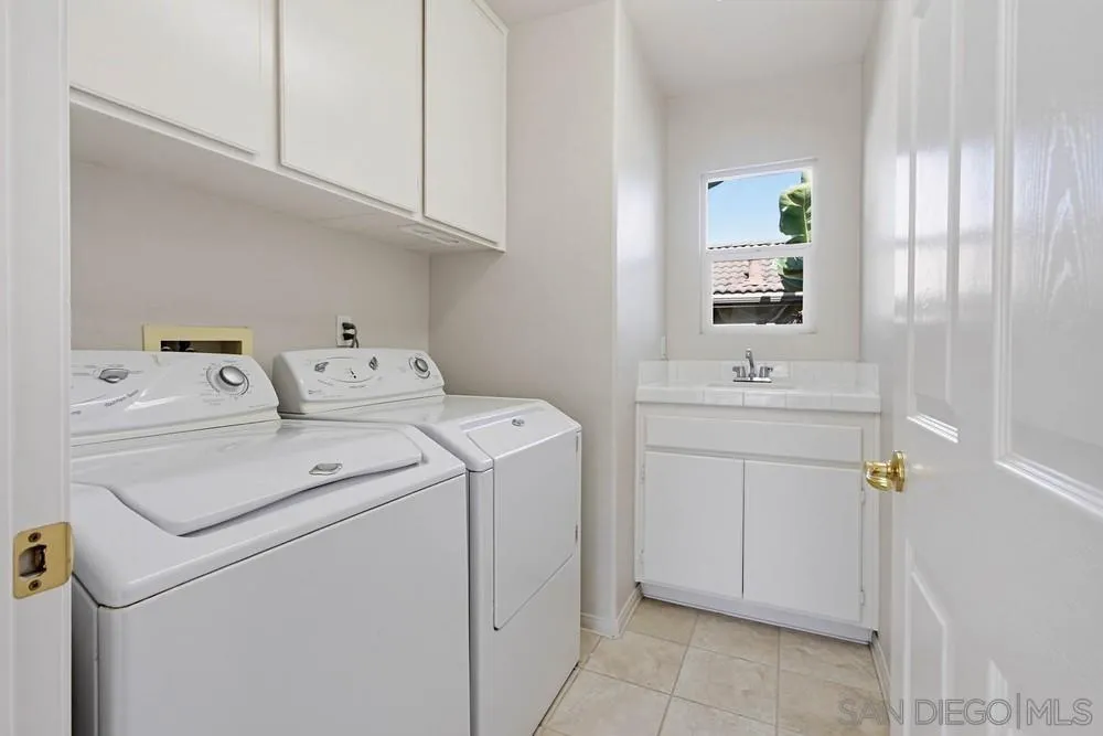 5423 Foxtail Loop Carlsbad, CA 92010 - Photo 41 of 67 a utility room with dryer and washer