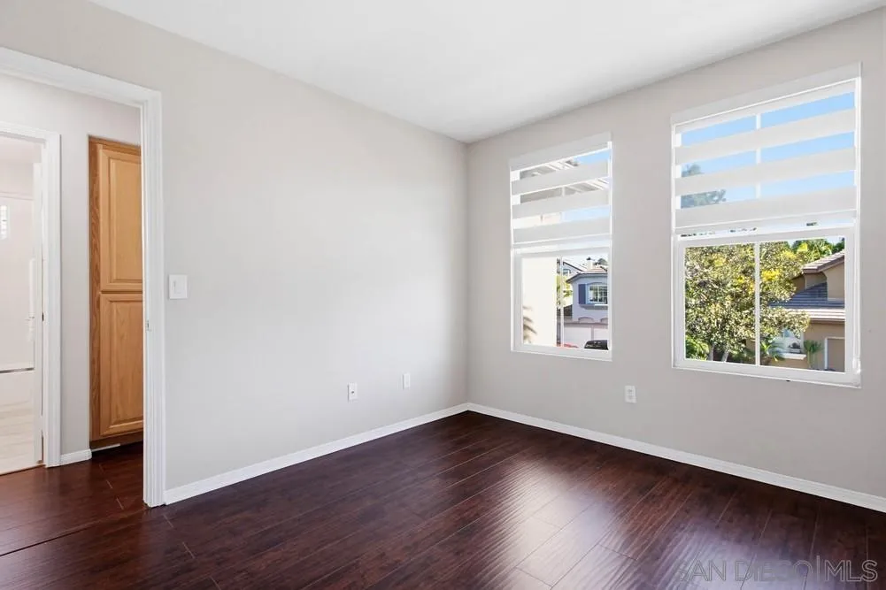 5423 Foxtail Loop Carlsbad, CA 92010 - Photo 48 of 67 a view of an empty room with wooden floor and a window