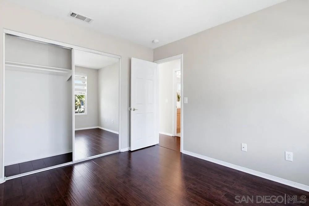 5423 Foxtail Loop Carlsbad, CA 92010 - Photo 49 of 67 a view of an empty room with wooden floor