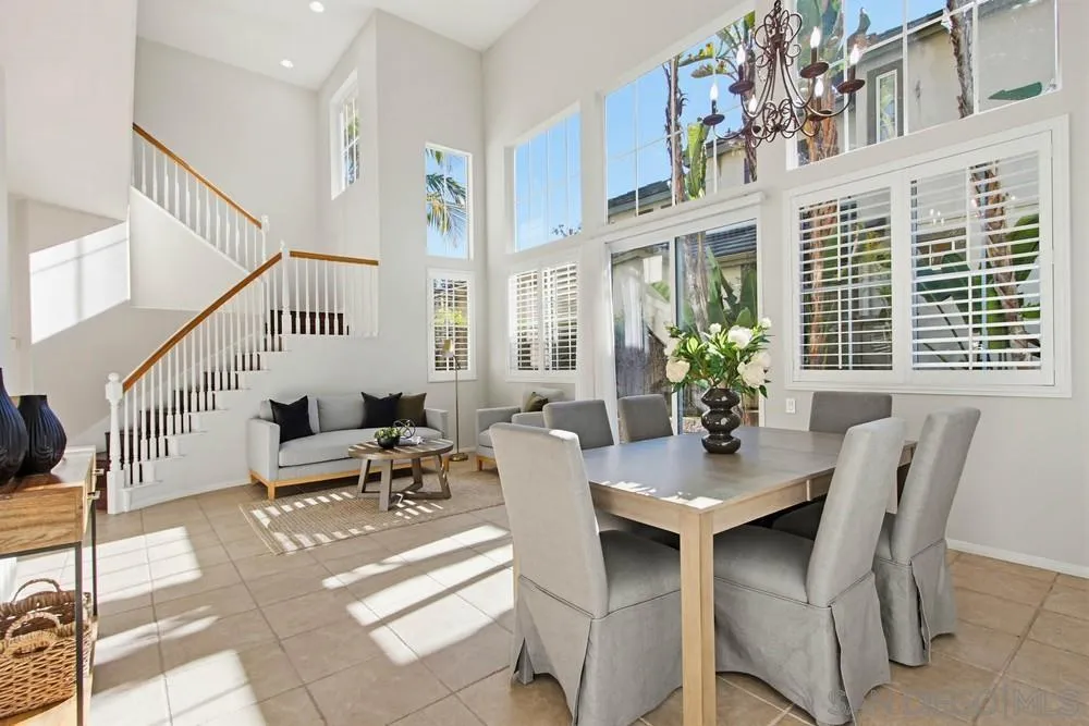 5423 Foxtail Loop Carlsbad, CA 92010 - Photo 8 of 67 a view of a dining room with furniture and a potted plant
