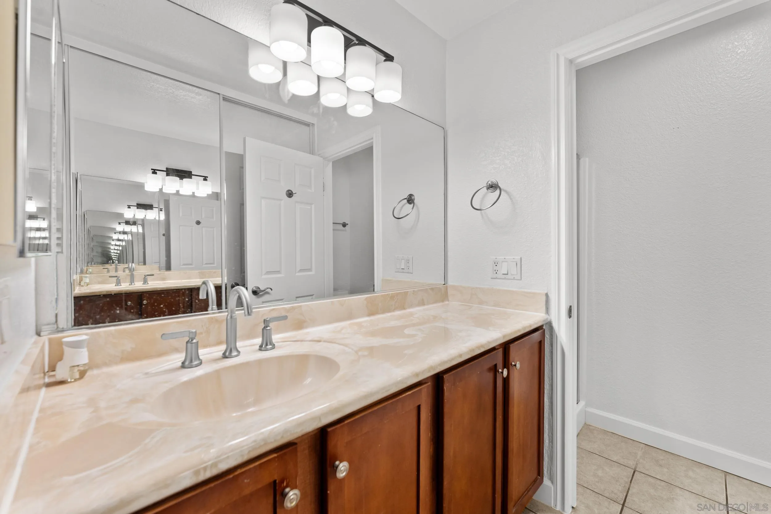 12745 Robison Boulevard Poway, CA 92064 - Photo 13 of 14 a bathroom with a sink double vanity and a mirror
