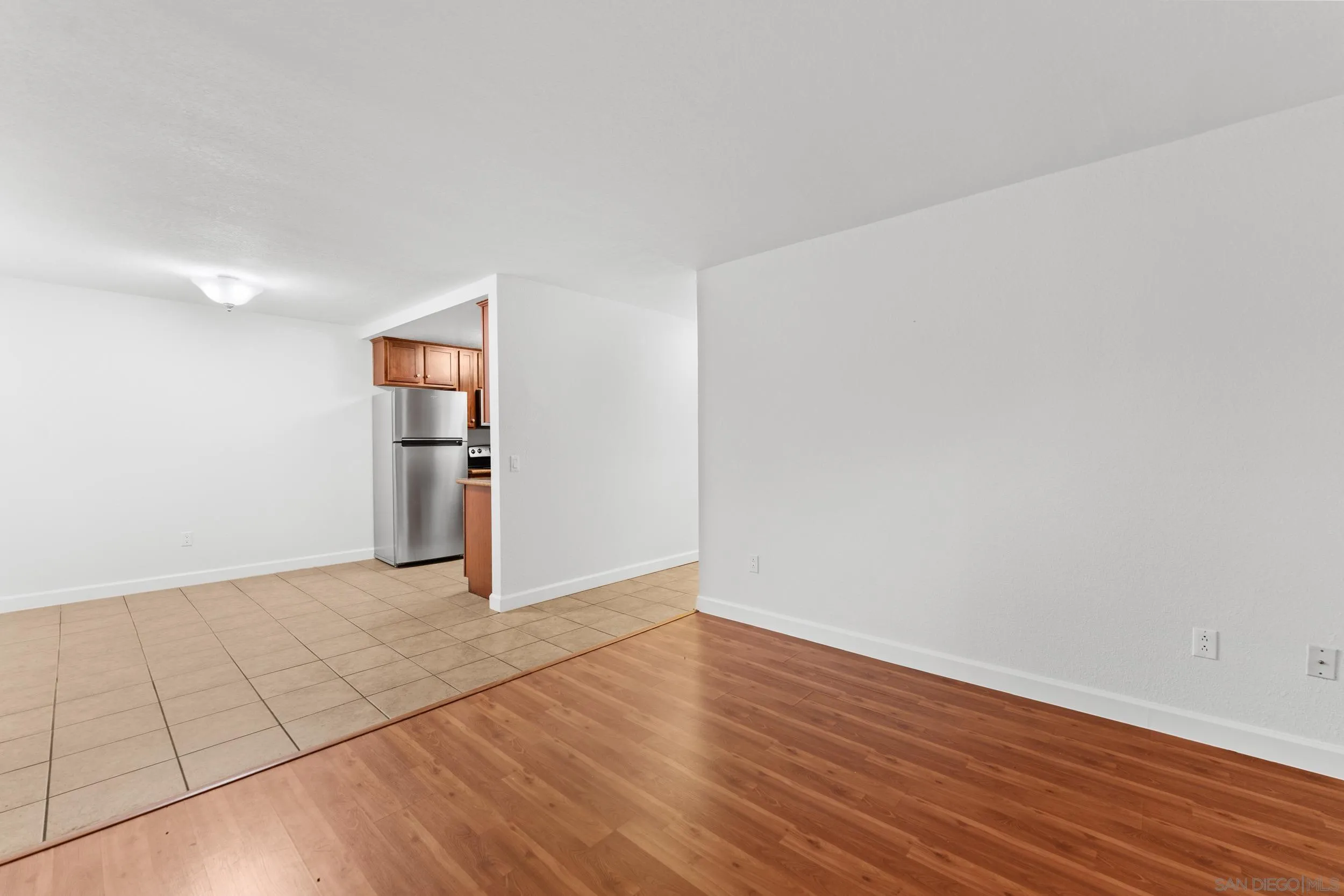 12745 Robison Boulevard Poway, CA 92064 - Photo 8 of 14 wooden floor in an empty room with a workspace