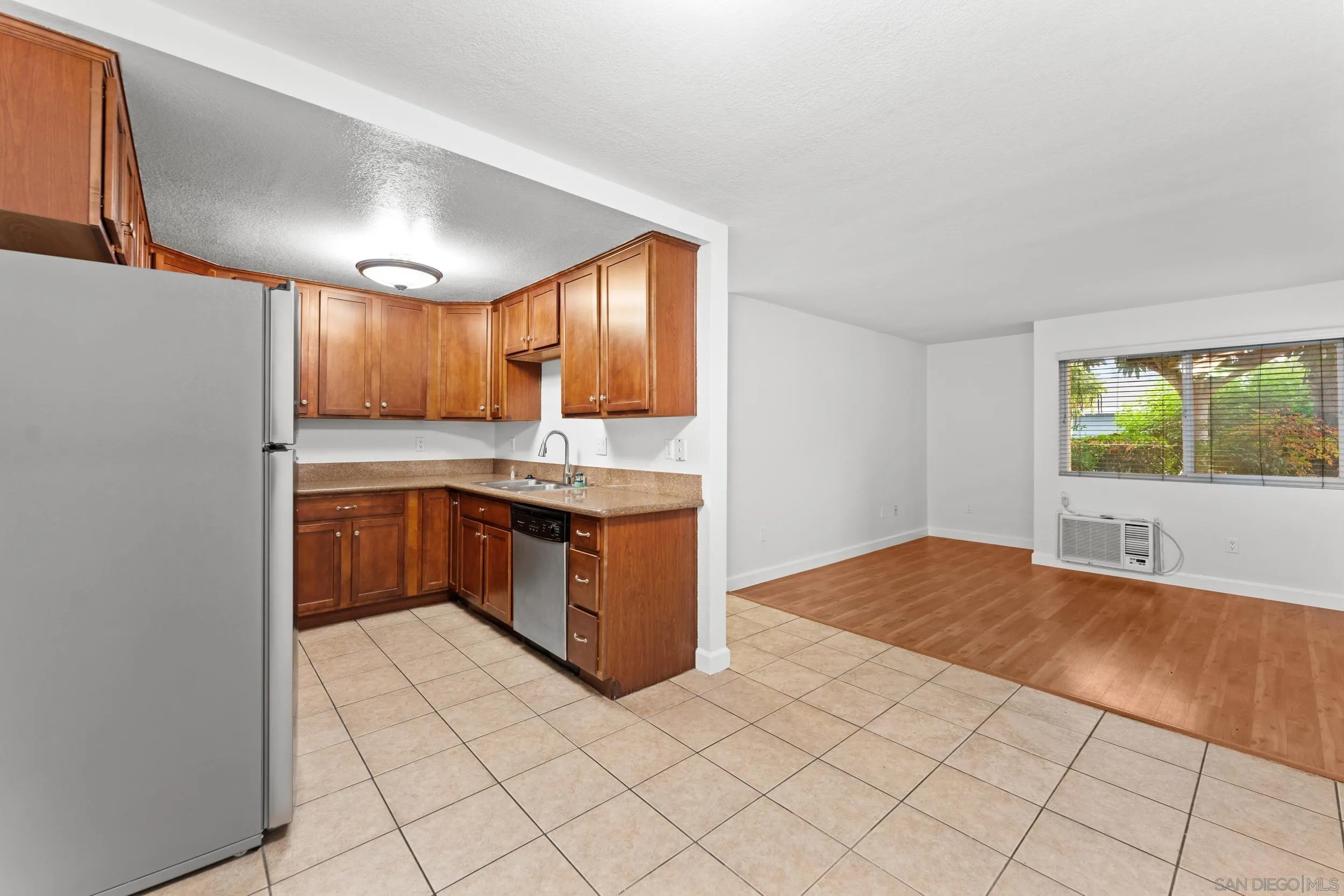 12745 Robison Boulevard Poway, CA 92064 - Photo 10 of 14 a kitchen with stainless steel appliances a refrigerator and a stove top oven