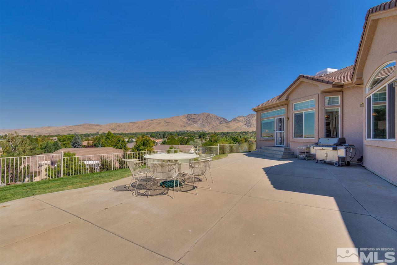 5419 Greenview Court Reno, NV 89502 - Photo 22 of 25 a view of a patio with couches table and chairs and a yard