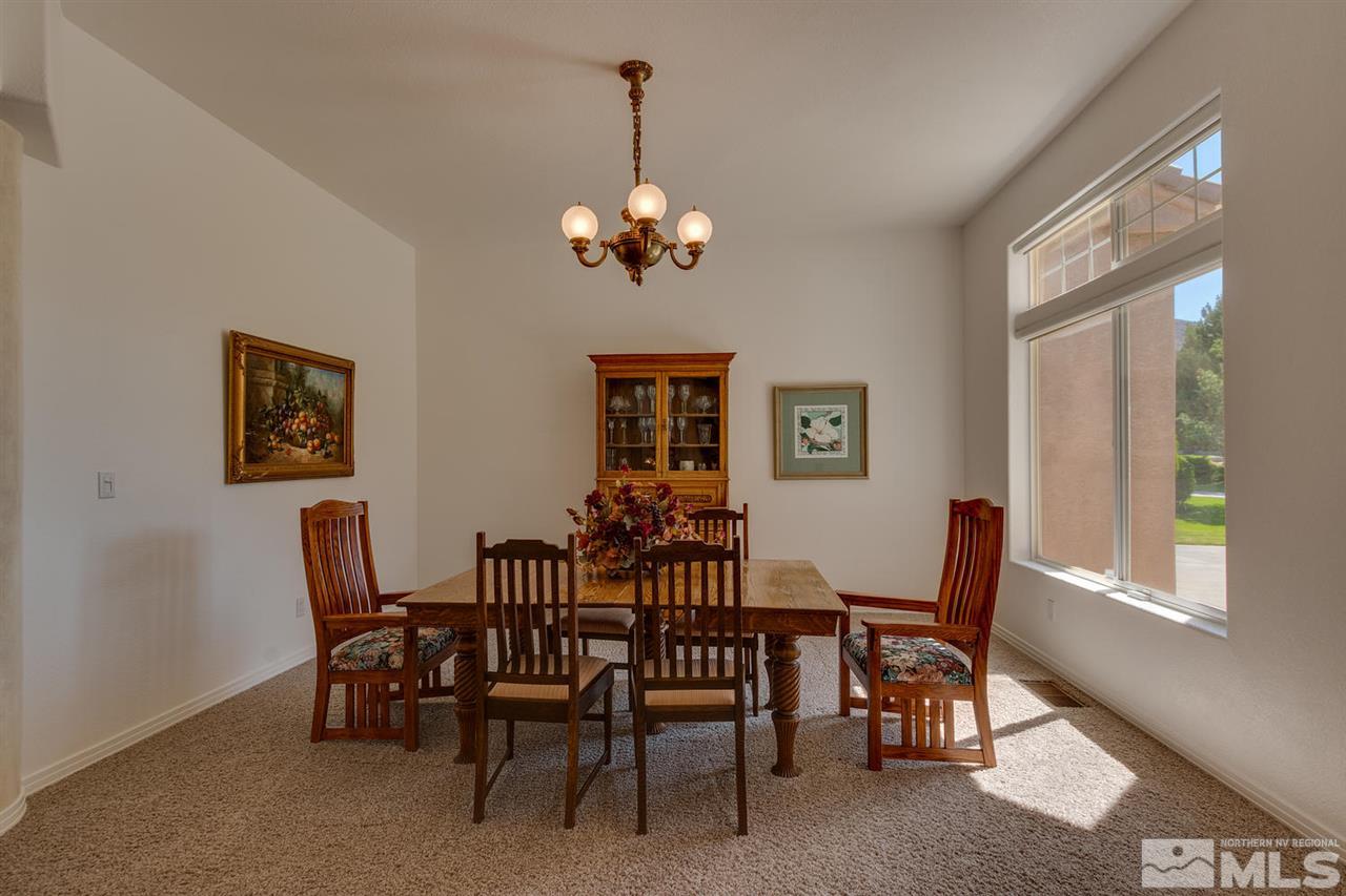 5419 Greenview Court Reno, NV 89502 - Photo 6 of 25 a view of a dining room with furniture and chandelier