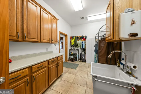a kitchen with a sink and cabinets