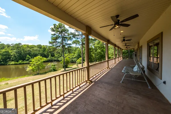 a view of a porch with wooden floor and outdoor space