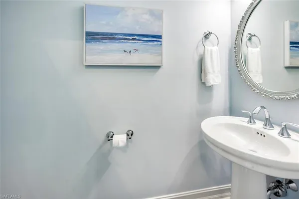 a bathroom with a sink and mirror