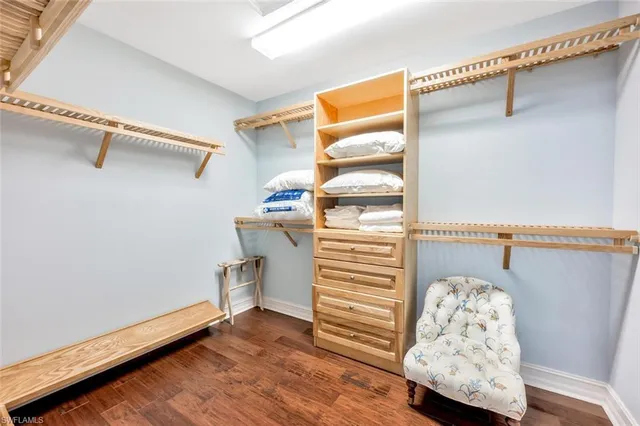 a view of a livingroom with wooden floor and a window