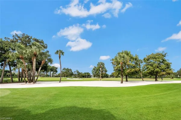 a view of a golf course with a lake