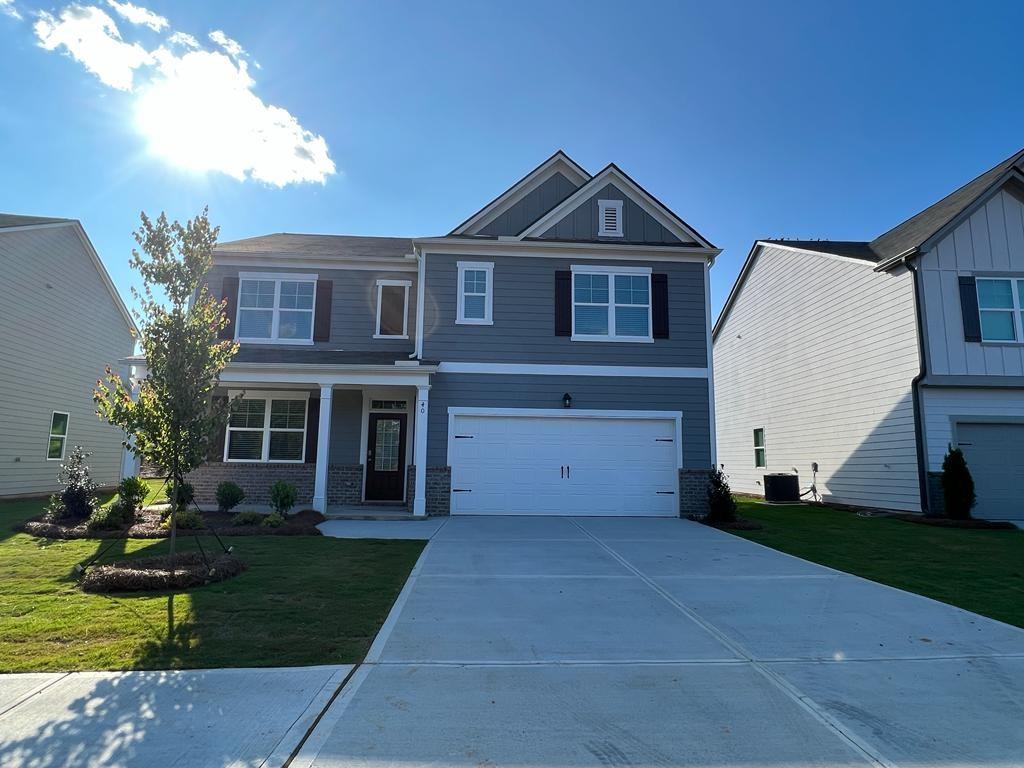 40 Berkeley Trace Braselton, GA 30517 - Photo 1 of 1 a front view of a house with garden