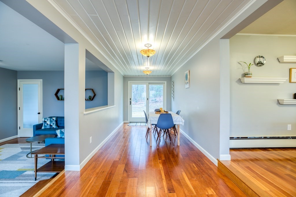 971 Ryan Road Northampton, MA 01062 - Photo 5 of 23 a view of a dining room with furniture a chandelier and wooden floor