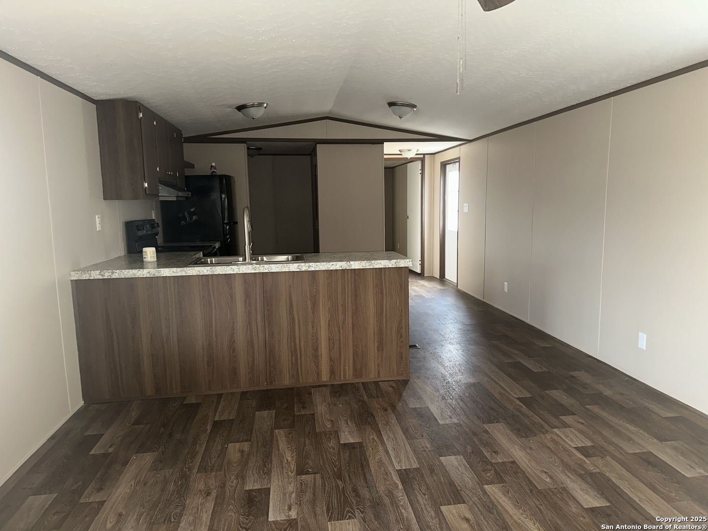 101 Villa Ridge Drive, Unit 6 Poteet, TX 78065 - Photo 4 of 14 a view of a room with wooden floor