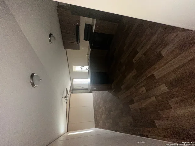 a bathroom with a glass door shower