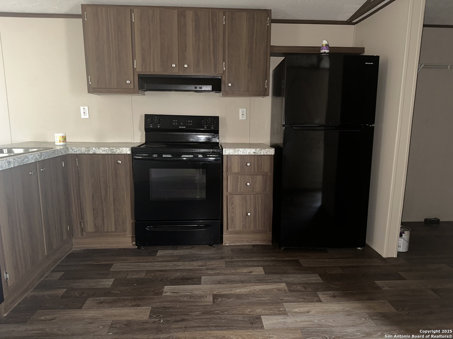 101 Villa Ridge Drive, Unit 6 Poteet, TX 78065 - Photo 7 of 14 a kitchen with stainless steel appliances granite countertop a refrigerator and a stove