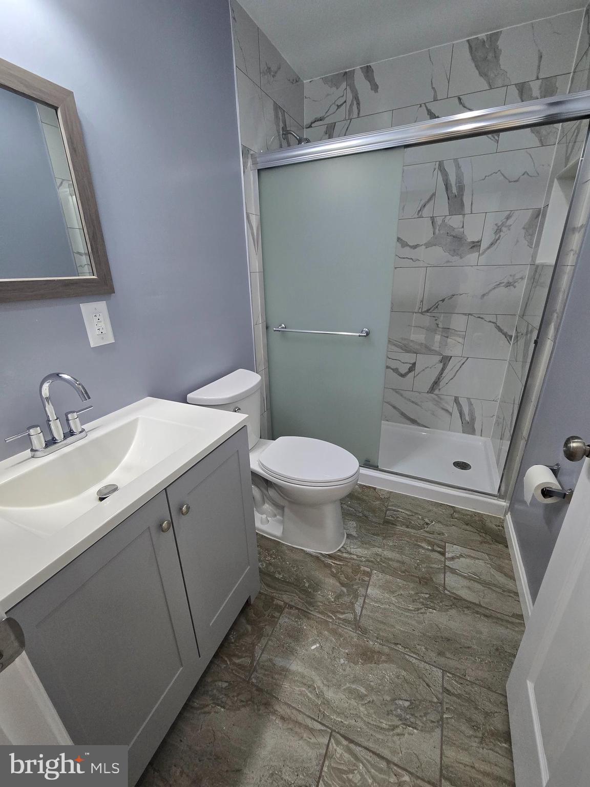 1926 North Payson Street Baltimore, MD 21217 - Photo 13 of 29 a bathroom with a sink a toilet and shower