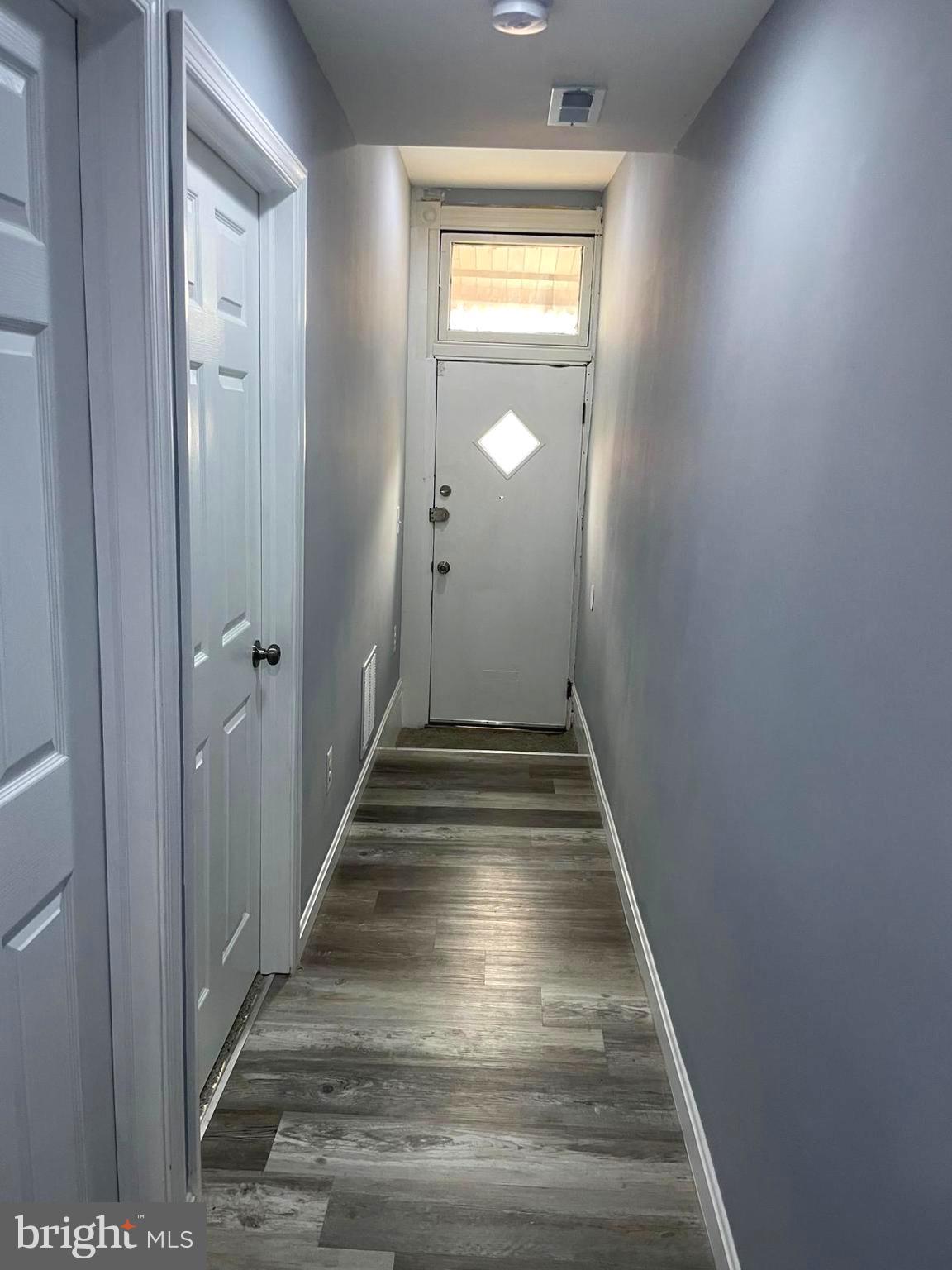1926 North Payson Street Baltimore, MD 21217 - Photo 3 of 29 a view of hallway with wooden floor