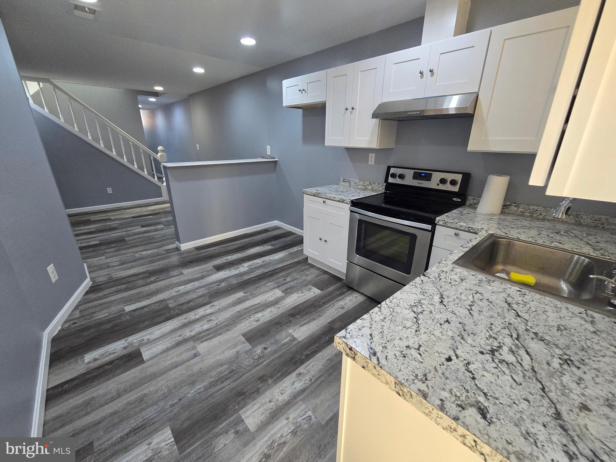 1926 North Payson Street Baltimore, MD 21217 - Photo 7 of 29 a kitchen with a stove and a sink