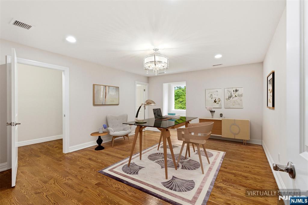 767 Orangeburgh Road River Vale, NJ 07675 - Photo 28 of 49 a living room with furniture and a chandelier