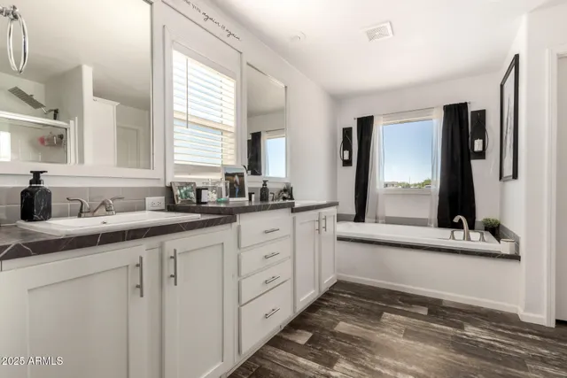 a bathroom with a shower and a mirror