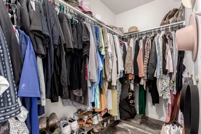 a bedroom with a large bed and a tv